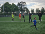 Laatste training S.K.N.W.K. JO10-1 (partijtje tegen de ouders) van woensdag 22 mei 2024 (10/133)